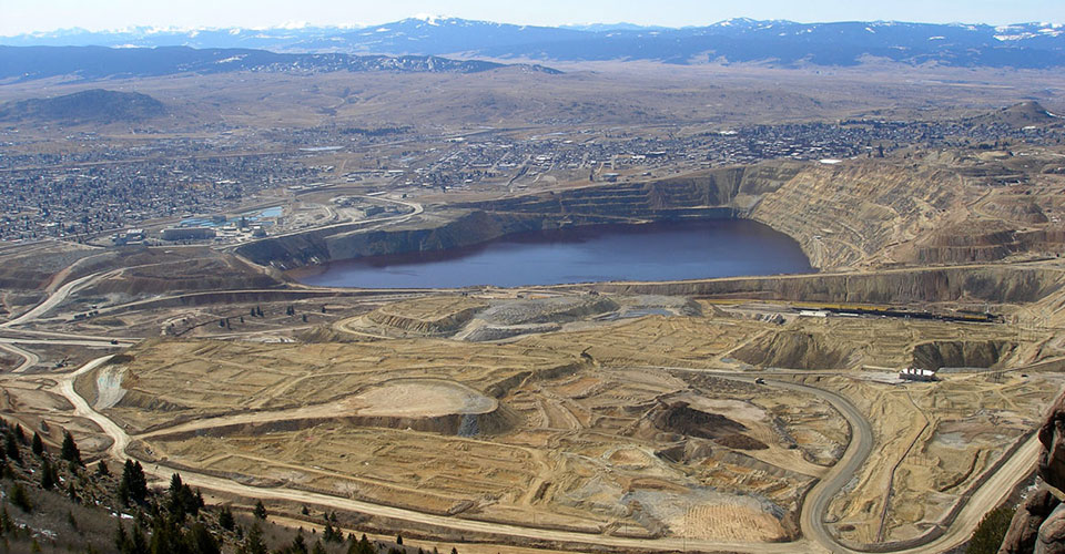The Berkeley Pit looking west from Rampart Mountain near Butte, Montana. The Pit water and connected underground mines and wells are monitored monthly by the Montana Bureau of Mines & Geology. Photo by Matt Vincent.
